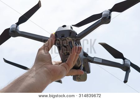 Female Hand Launches Drone For Flight, With Which You Can Take Photos And Video Filming, Close-up.