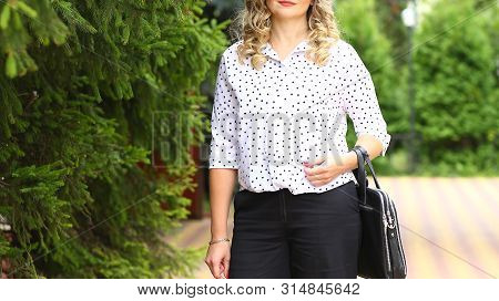 Stylish Business Woman 
With Little Arm Outdoors In Summer