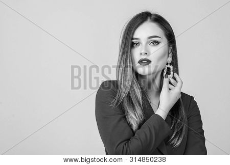 Woman Wear Glamorous Earrings. Fashion Trend. Jewelry Shop. Girl Model Long Hair Demonstrating Golde