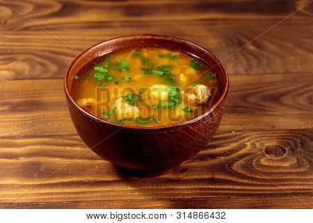 Kharcho Soup With Meat And Rice On Wooden Table