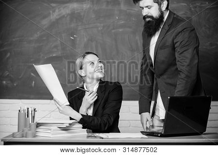 Digital World. Teacher And Student On Exam. Business Couple Use Laptop And Documents. Paper Work. Of
