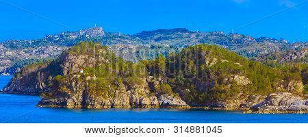Norwegian Landscape With Fjord Water, Mountains And Lighthouse, Norway, Banner Panoramic Background