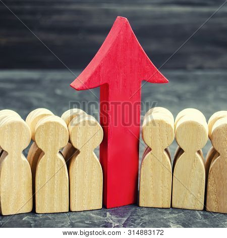 Business Team And Red Up Arrow Between Employees. The Concept Of A Startup. Successful Business Grow