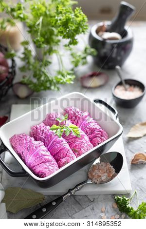 Stuffed Red Beijing Cabbage. The Process Of Cooking Purple Cabbage With Meat.
