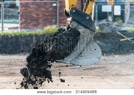 A Digger And Dump Truck Move Dirt To Make Room For The Foundations Of The New Waverley School In She