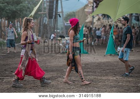 Riomalo De Abajo, Extremadura, Spain - July 13, 2018: Two Girls Walks Near The Main Stage Of The Los
