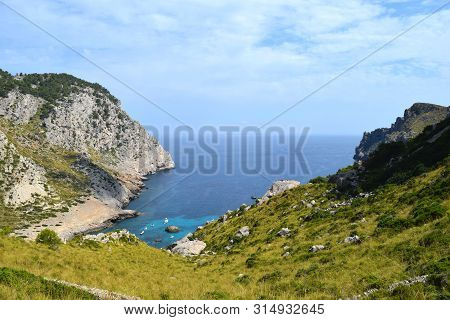 Sea Bay With Turquoise Water, Beach And Mountains, Cala Figuera On Cap Formentor
