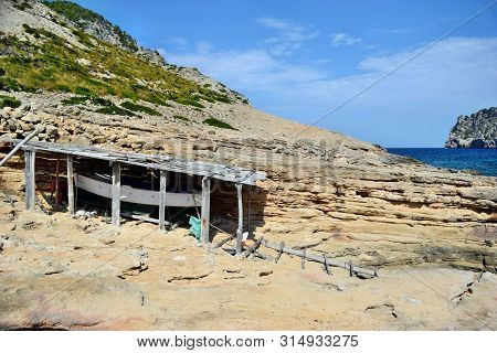 Sea Bay With Boat, Beach And Mountains, Cala Figuera On Cap Formentor
