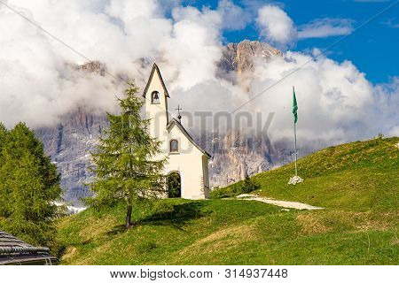 San Maurizio Chapel On The Passo Di Val Gardena With Mountain View In Background. Colorful View In P