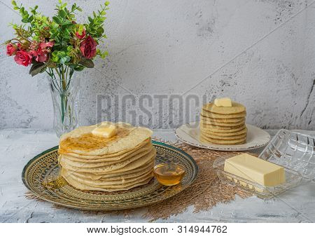 Moroccan Pancakes Baghrir  Beghrir Or Crapes With 1000 Holes Served With Honey And Butter On Grey Ba