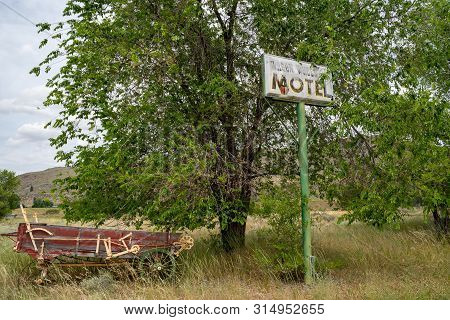 Methow, Washington - July 5, 2019: Old Abandoned Sign For The Former Wagon Wheel Cafe And Motel, Clo