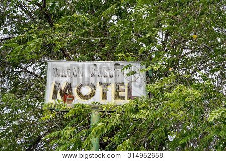 Methow, Washington - July 5, 2019: Old Abandoned Sign For The Former Wagon Wheel Cafe And Motel, Clo