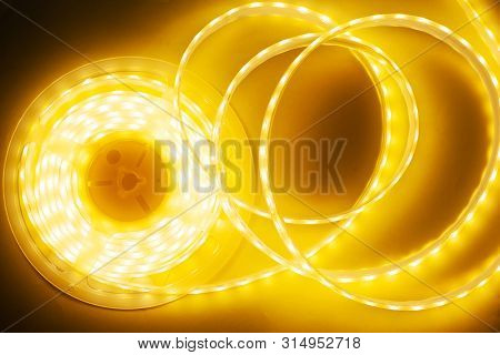 Bright Yellow Led Strip, Diode Strip, A Coil  Of Silicone Strip Close-up