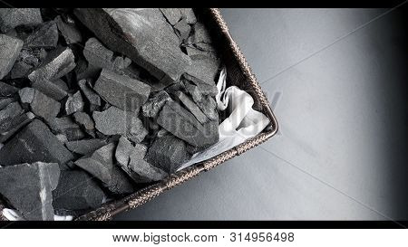 Black Color Wooden Charcoals On Dark Background Top View