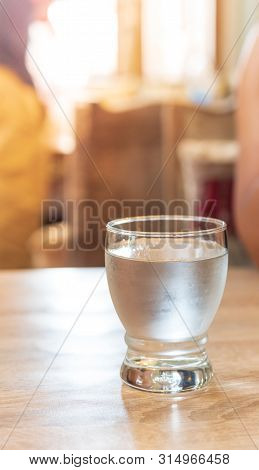 Drinking Water In A Clear Glass On The Wood, Natural Light