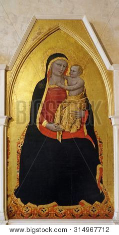 FLORENCE, ITALY - JANUARY 10, 2019: Madonna and Child, by Nardo di Cione, Basilica di Santa Croce (Basilica of the Holy Cross) - famous Franciscan church in Florence, Italy