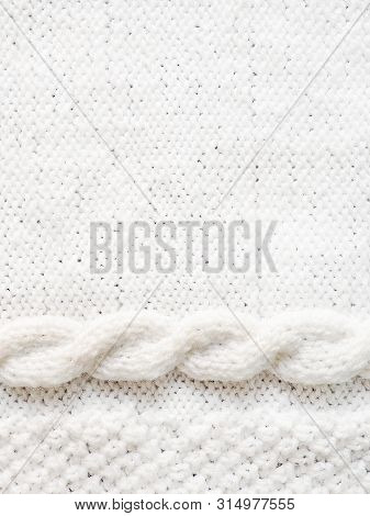 Texture Of White Knitted Woolen Sweater. Winter Seadon Background