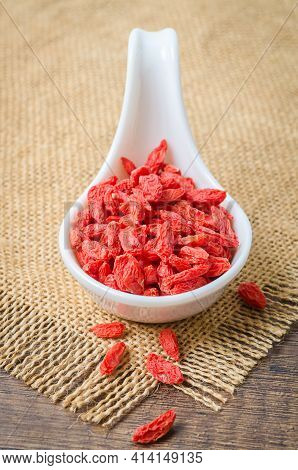 Dried Chinese Wolfberries Or Goji Berries In White Spoon.