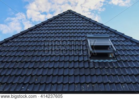 Open Roof Window In Velux Style With Black Roof Tiles