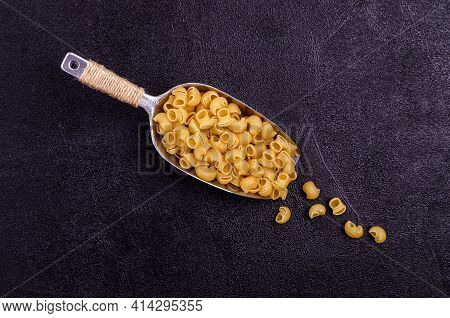 Traditional Dry Pasta On A Black Background. Design Concept. A Copy Of The Space. Selective Focus.