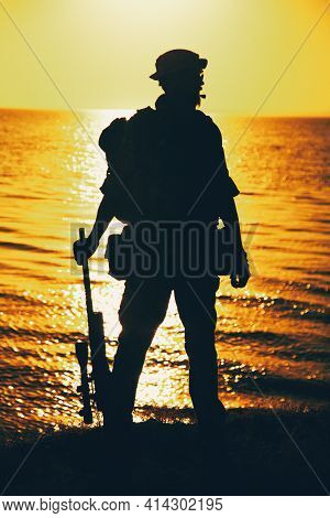 Silhouette Of Army Commando Fighter, Navy Seals Team Sniper Or Coast Guard Soldier Standing On Sea S