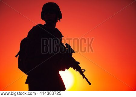 Silhouette Of Army Special Forces Rifleman, Marines, Coast Guard Or Anti-terrorist Squad Soldier In 