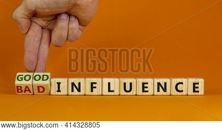 Good Or Bad Influence Symbol. Businessman Turns Cubes And Changes Words 'bad Influence' To 'good Inf