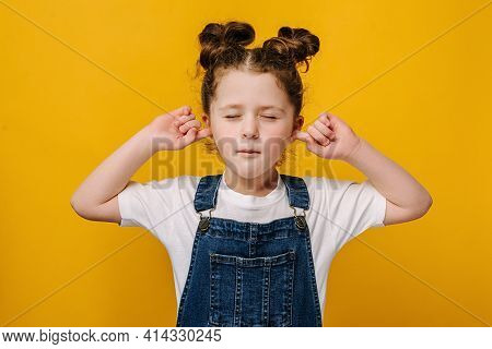 Unhappy Little Girl Kid With Having Discontent Look Plugging Her Ears Being Annoyed With Noise Wanti