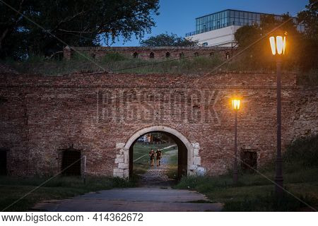 Belgrade, Serbia - August 29, 2020: Two Men Walking At Night In The Vidin Kapija Gate T Night. Vidin