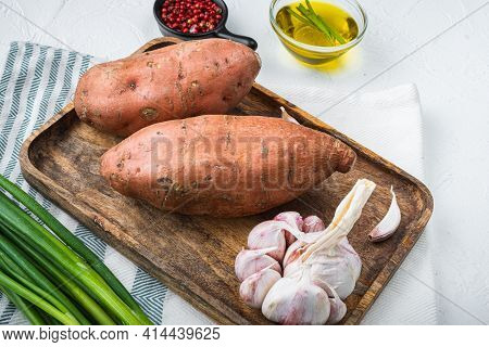 Sweet Potato Or Batat With Spices On White Background.