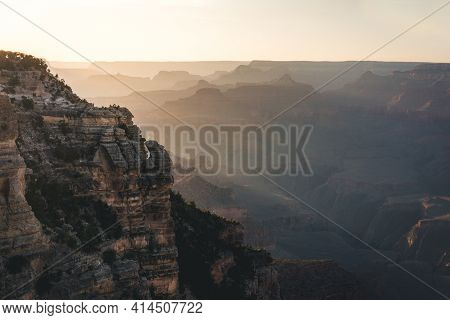 Silhouette Of Man On Cliff During Sunset At Grand Canyon National Park, View From South Rim, Arizona