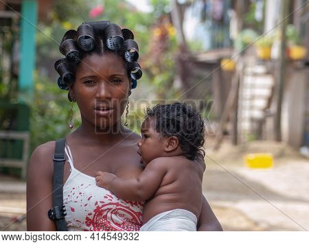 Darien Province, Panama. 07-18-2019. Portrait Of An Afro-descendent Woman Mother And Her Daughter In