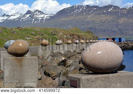 Stone Bird Eggs On The Seafront In Djupivogur In Iceland. Summer 2017