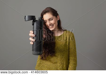 Woman Holding Eco Reusable Smart Thermo Water Bottle With Drink Reminder, Healthy Lifestyle Concept