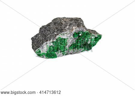 Macro Stone Garnet Mineral, Uvarovite In Rock On A White Background