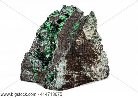Macro Stone Garnet Mineral, Uvarovite In Rock On A White Background