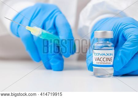 Covaxin Vaccine Against Coronavirus And Syringe For Injection In Health Worker Hand In Rubber Gloves