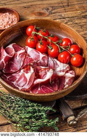 Italian Sliced Cured Coppa Ham With . Wooden Background. Top View
