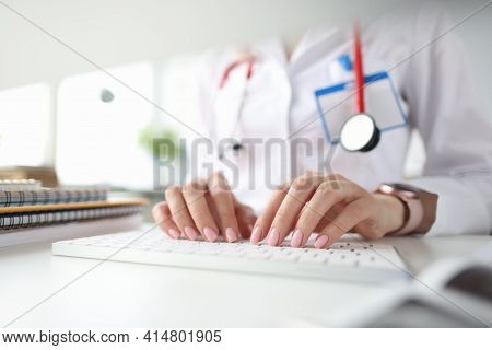 Doctor Hands On White Keyboard. Getting Medical Education