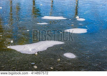 Frozen Water Of A Pond With Pieces Of Ice, Hoarfrost, Sunny Winter Day In Kasteelpark Elsloo, South 