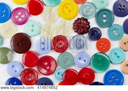 Colorful Bright Buttons On A White Background. Old Vintage Buttons Close-up. Copy Space. Top View. B