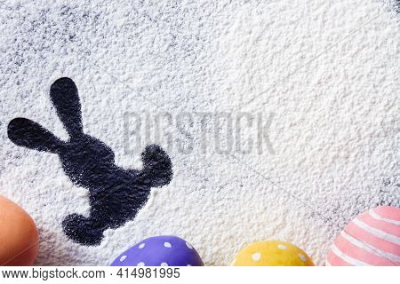 Traces Of Flour Or Powdered Sugar In The Form Of Easter Figures On The Kitchen Table In The Process 