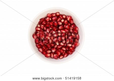 Pomegranate Seeds In A White Bowl