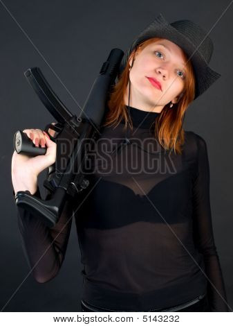 Young Woman Holding The Gun