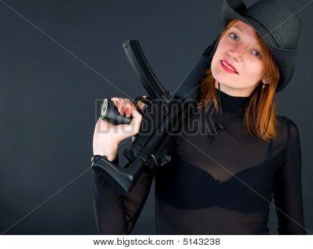 Young Woman Holding The Gun