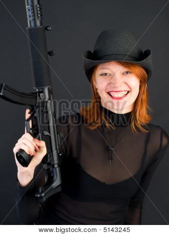 Young Woman Holding The Gun