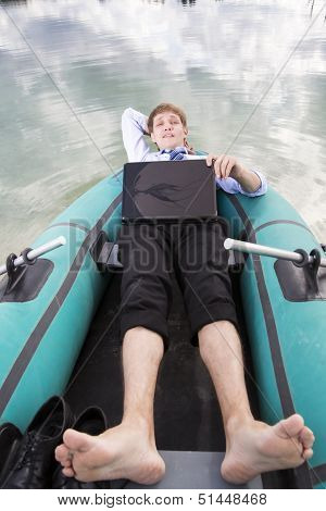 Dressed Man Lay In Boat