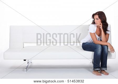 beautiful woman sitting on a couch