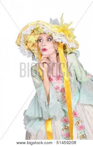 Theatrical woman dressed in a large bonnet and flouncy dress