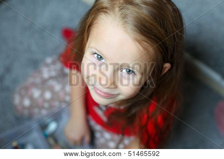 Close-up Face Of A Beautiful Blue-eyed Little Cute Girl